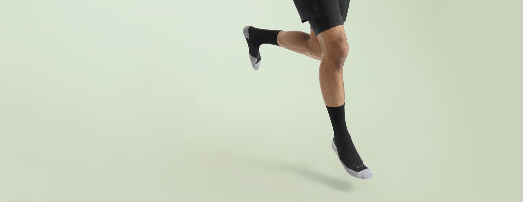 A runner wearing Sheec ComFits compression performance socks.